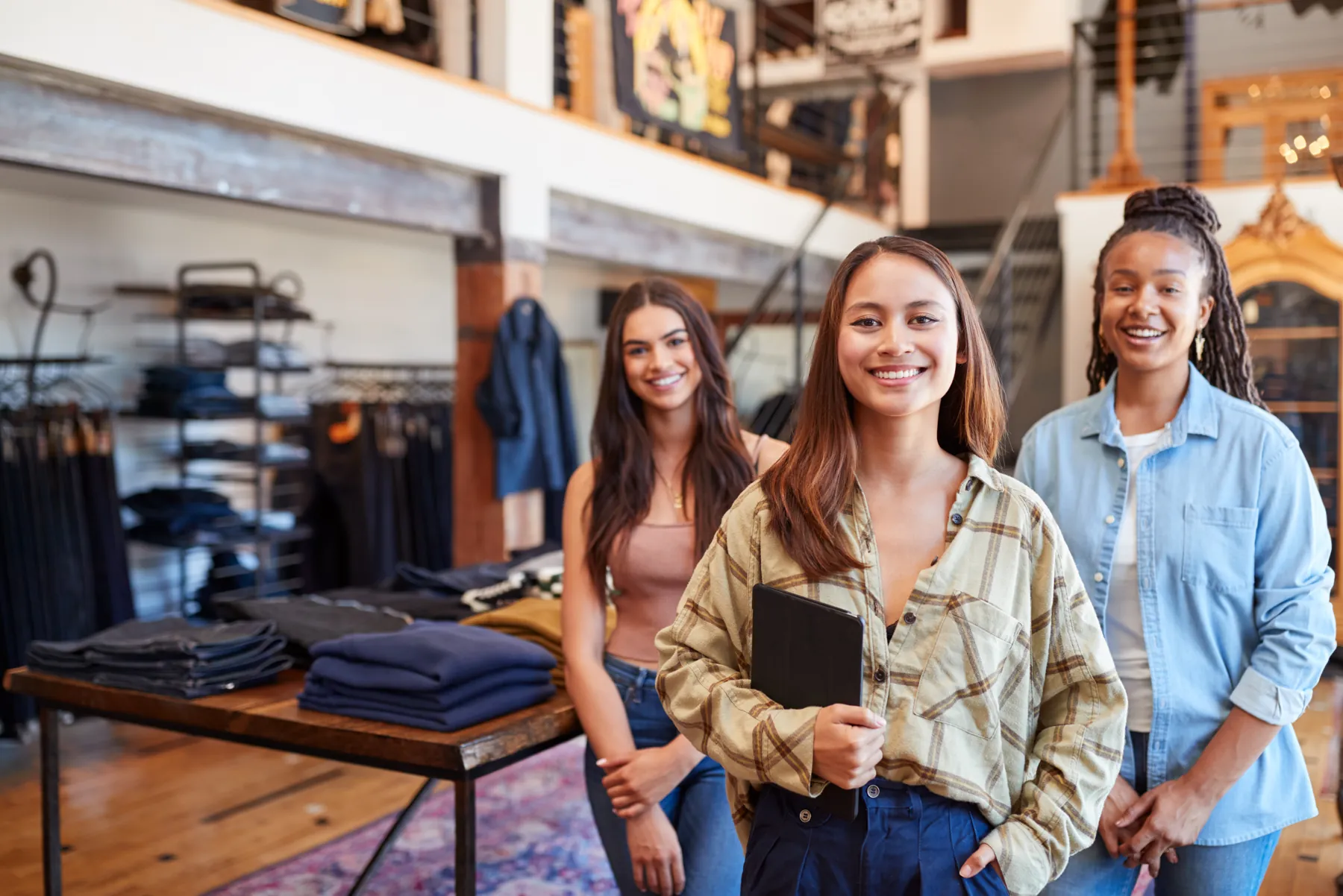 A smiling retail team in their store